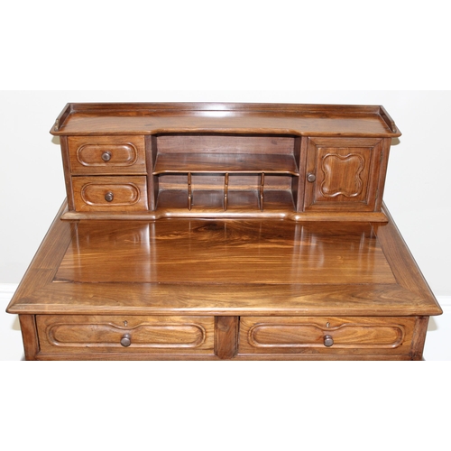 96 - A 20th century Oriental hardwood ladies' desk with 2 lower drawers and a stationary rack top, carved... 