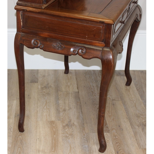 96 - A 20th century Oriental hardwood ladies' desk with 2 lower drawers and a stationary rack top, carved... 