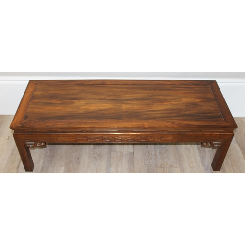 97 - A 20th century Oriental hardwood low or coffee table, carved details, 20th century, approx 127cm wid... 