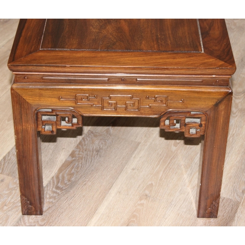 97 - A 20th century Oriental hardwood low or coffee table, carved details, 20th century, approx 127cm wid... 