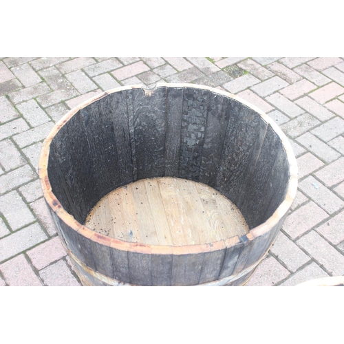 327 - Pair of vintage half sized wooden coopered barrel planters, approx 71cm W x 41cm H