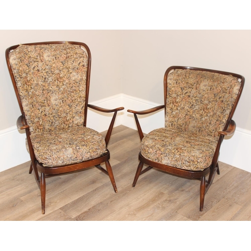 10 - 2 vintage Ercol armchairs with patterned upholstery and stick backs, the larger approx 73cm wide x 8... 