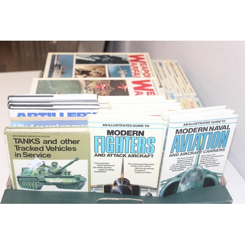 563 - Large qty of military related magazines and books to include Combat Aircraft magazine, Armed Forces ... 