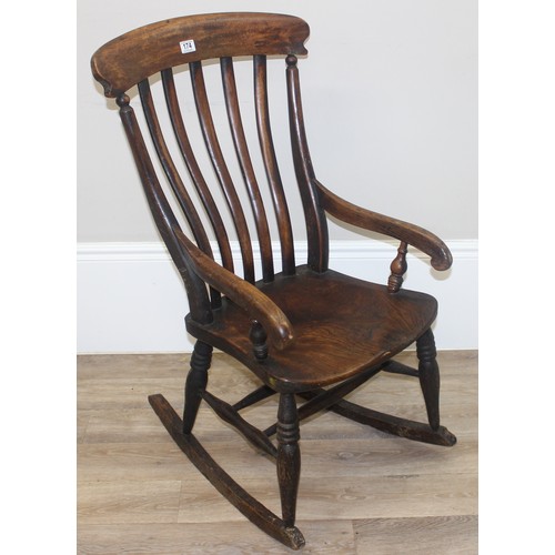 174 - Antique slat back Windsor rocking chair with elm seat, approx 102cm H