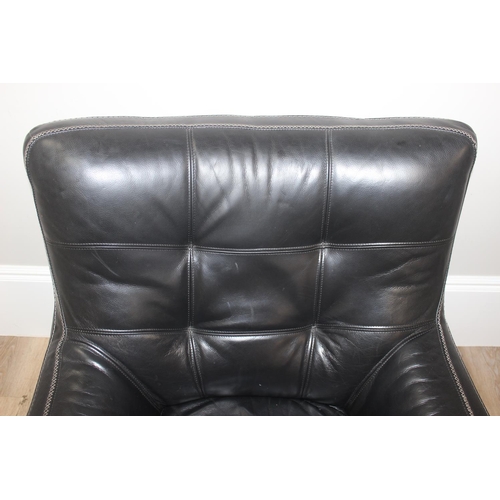 59 - Retro style black and chrome leatherette swivel armchair, approx 90cm x 86cm x 96cm