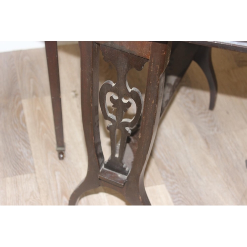 18 - An Edwardian Sutherland table with carved fretwork base, approx 71cm w x 61 cm D x 60cm H when raise... 