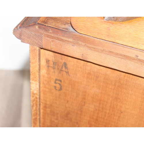 15 - A large 17th century style heavily carved oak sideboard with a central carved cupboard flanked by 2 ... 