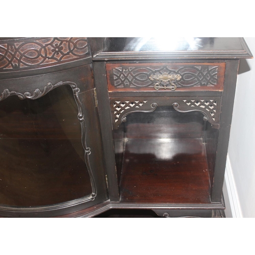 22 - A Victorian ebonised chiffonier or sideboard with mirror and shelf top with domed glass display cabi... 