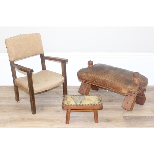 19 - A vintage leather topped camel stool, a further small pine stool with embossed leather top decorated... 