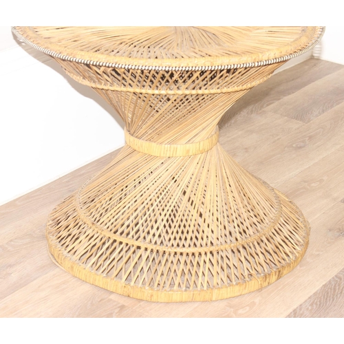 41 - A vintage retro wicker table of twisted form, similar to the base of a peacock chair, approx 61cm in... 