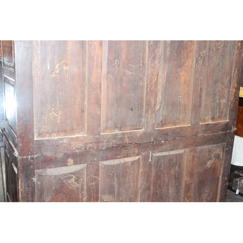 16 - An 18th century oak court cupboard with Georgian brass handles, dated 1754 and believed to be of tha... 