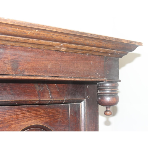 16 - An 18th century oak court cupboard with Georgian brass handles, dated 1754 and believed to be of tha... 