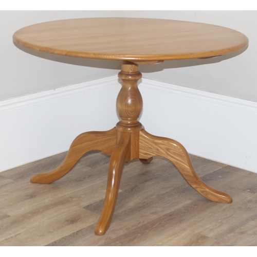 4 - A retro Ercol circular dining table, design number 1116, on 4 legged pedestal base, blonde finish, a... 