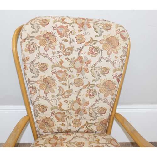 8 - Ercol blonde high back lounge chair with floral designed cushions, approx 115cm tall