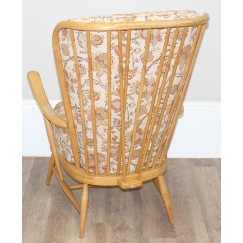 8 - Ercol blonde high back lounge chair with floral designed cushions, approx 115cm tall