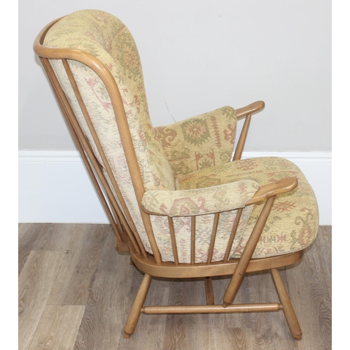 9 - Ercol high back lounge chair with Aztec style patterned cushions, approx 108cm tall