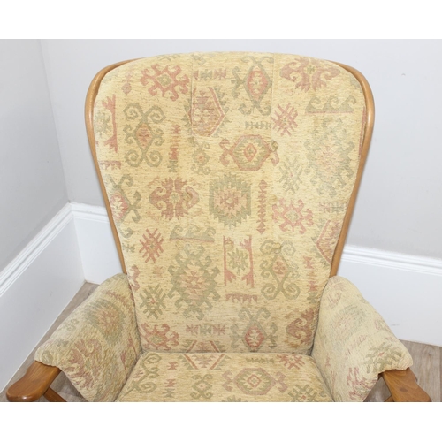 9 - Ercol high back lounge chair with Aztec style patterned cushions, approx 108cm tall