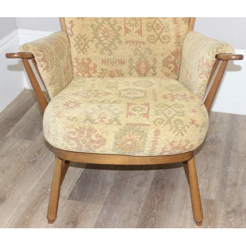 9 - Ercol high back lounge chair with Aztec style patterned cushions, approx 108cm tall