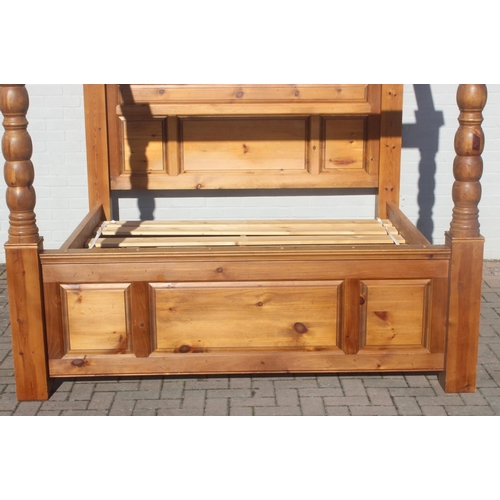 25 - A vintage pine 4 poster bed frame to fit a Super King size mattress, the frame approx 215cm tall