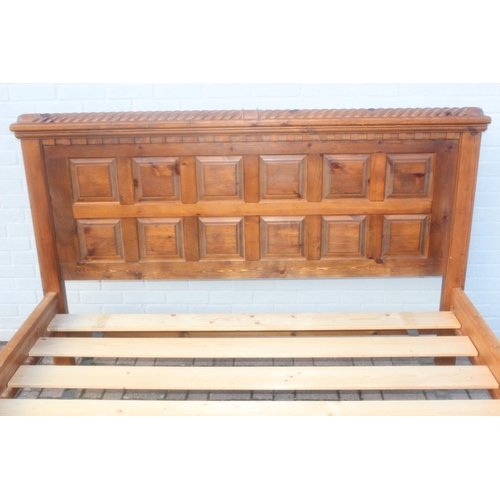 26 - A rustic panelled pin bed frame with twisted decoration, to fit a king size mattress, approx 128cm t... 