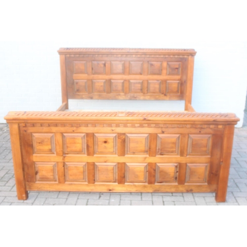 26 - A rustic panelled pin bed frame with twisted decoration, to fit a king size mattress, approx 128cm t... 