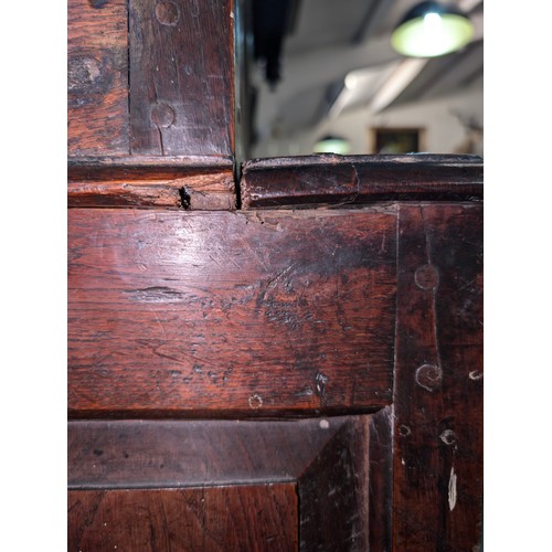 16 - An 18th century oak court cupboard with Georgian brass handles, dated 1754 and believed to be of tha... 