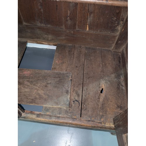 16 - An 18th century oak court cupboard with Georgian brass handles, dated 1754 and believed to be of tha... 