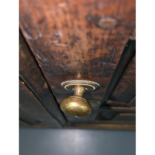 16 - An 18th century oak court cupboard with Georgian brass handles, dated 1754 and believed to be of tha... 