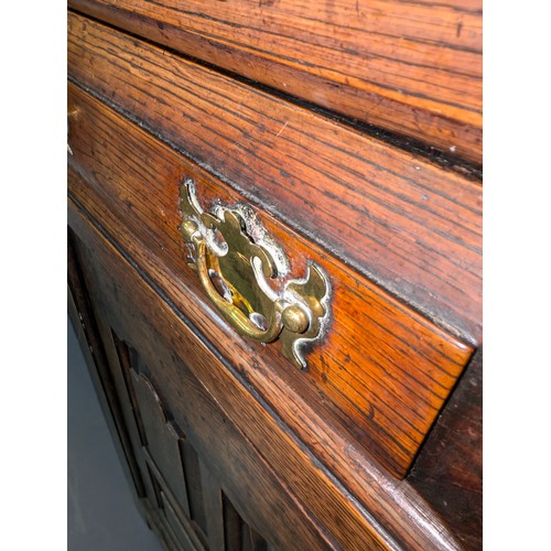 16 - An 18th century oak court cupboard with Georgian brass handles, dated 1754 and believed to be of tha... 