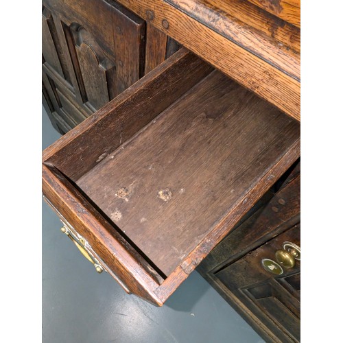 16 - An 18th century oak court cupboard with Georgian brass handles, dated 1754 and believed to be of tha... 