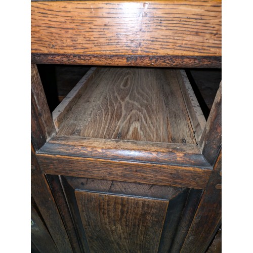 16 - An 18th century oak court cupboard with Georgian brass handles, dated 1754 and believed to be of tha... 