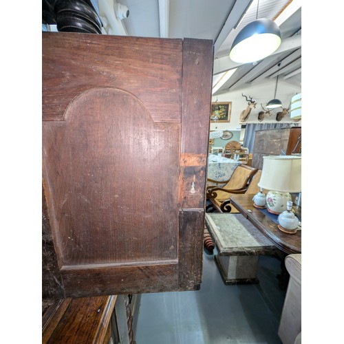 16 - An 18th century oak court cupboard with Georgian brass handles, dated 1754 and believed to be of tha... 