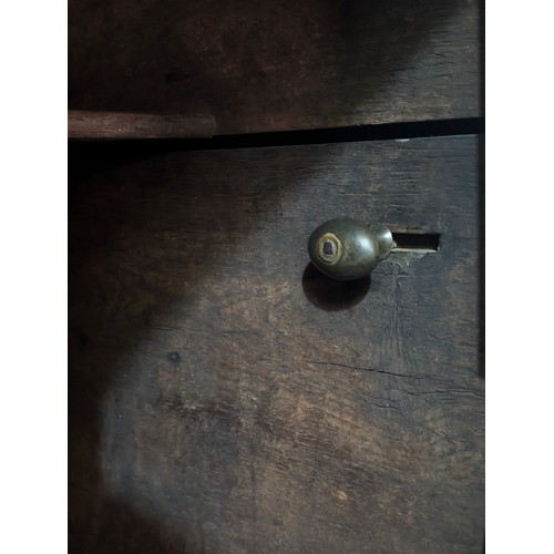 16 - An 18th century oak court cupboard with Georgian brass handles, dated 1754 and believed to be of tha... 