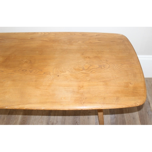 1 - A retro Ercol rectangular topped dining table, blonde finish, approx 153cm W x 77cm D x 70cm H