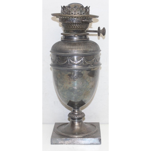 1010 - A 19th century silver plated oil lamp base of classical form, seemingly unmarked, approx 34cm tall