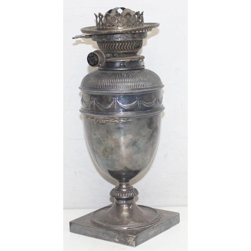 1010 - A 19th century silver plated oil lamp base of classical form, seemingly unmarked, approx 34cm tall