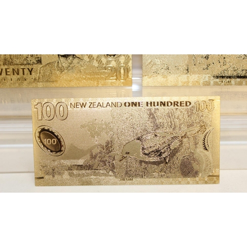 1215 - A set of New Zealand Polymer gold coloured banknotes, in display folder, denominations from $5 to $1... 