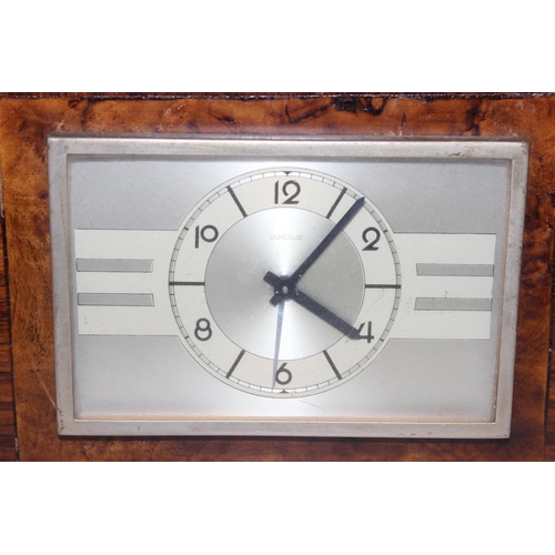 1304 - Art Deco Italian mantel clock by Di Meglio, with mechanical movement and a brown wooden and leather ... 