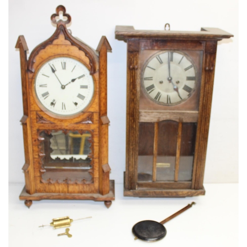 1309 - 2 vintage oak wall clocks, one in Gothic Revival style case, both with pendulums, the largest approx... 