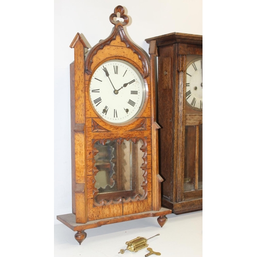 1309 - 2 vintage oak wall clocks, one in Gothic Revival style case, both with pendulums, the largest approx... 