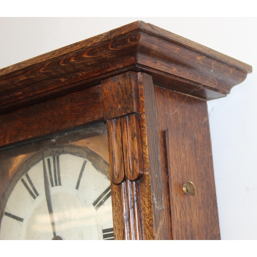 1309 - 2 vintage oak wall clocks, one in Gothic Revival style case, both with pendulums, the largest approx... 