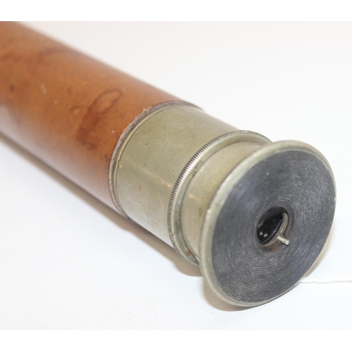 769A - An early 20th century Negretti & Zambra telescope with leather case , 