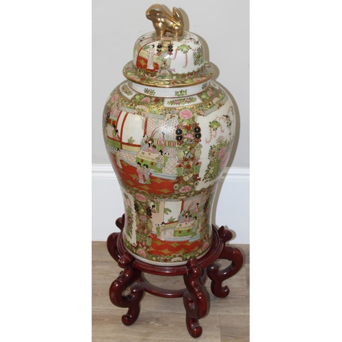 1564 - A very large Chinese porcelain temple jar or vase on wooden stand, Famille Rose palette, mid-late 20... 