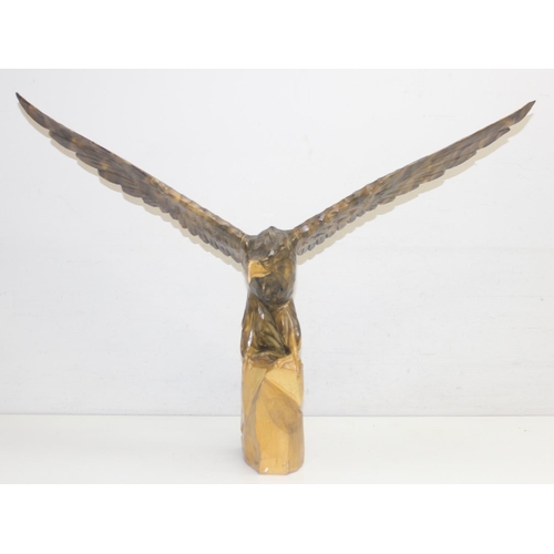 1601 - Vintage chip carved wooden model of an eagle perched on a stump with loose wings, approx 77cm W x 55... 