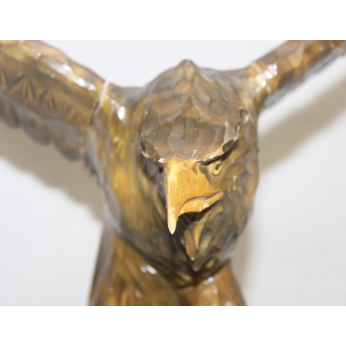 1601 - Vintage chip carved wooden model of an eagle perched on a stump with loose wings, approx 77cm W x 55... 