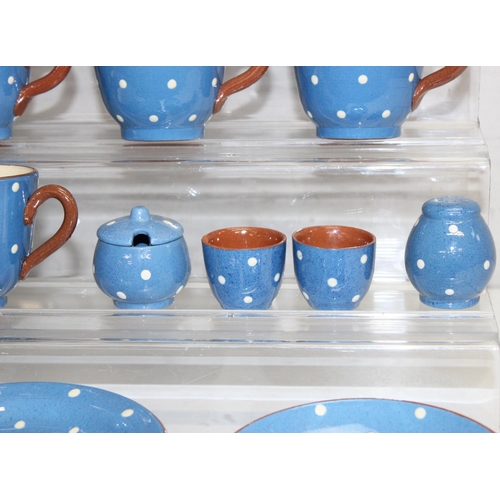 1614 - Qty of Watcombe Tourquay Pottery items in blue with white spots, to incl teapot, cups, saucers, plat... 