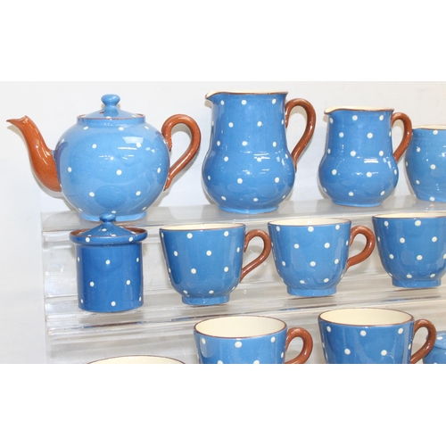 16141634 - Qty of Watcombe Tourquay Pottery items in blue with white spots, to incl teapot, cups, saucers, plat... 