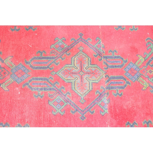 200 - Vintage red runner rug believed to be a Turkish Oushak rug, part repaired, approx 264cm x 100cm