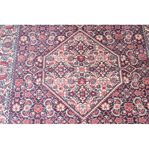 201 - A highly decorative Persian style rug made by Kasak, approx 202cm x 127cm