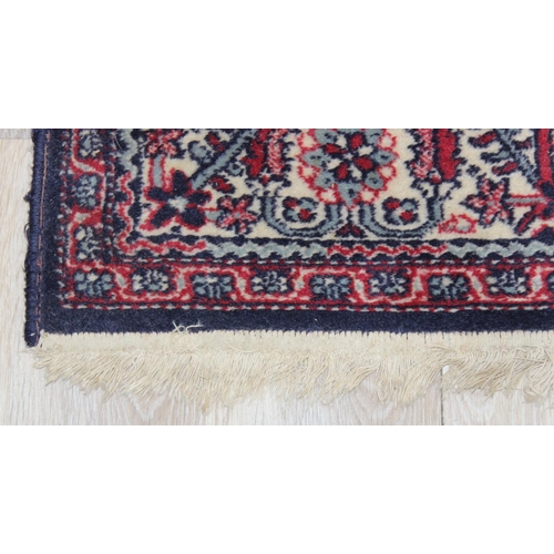 201 - A highly decorative Persian style rug made by Kasak, approx 202cm x 127cm